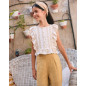 Blusa de niña blanca con estampado mostaza y volantes laterales-Dadati